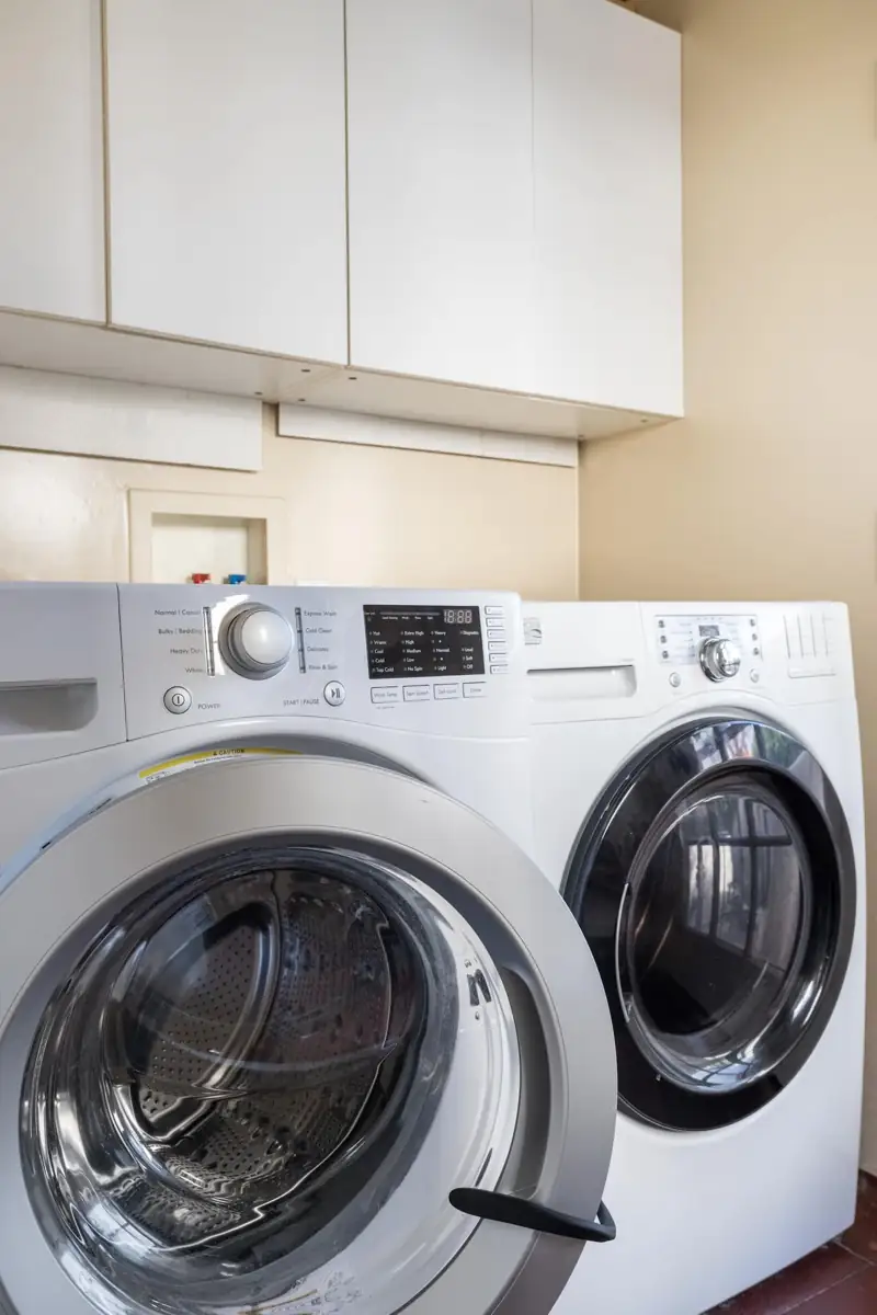 Laundry Room with washer, dryer and laundry detergent